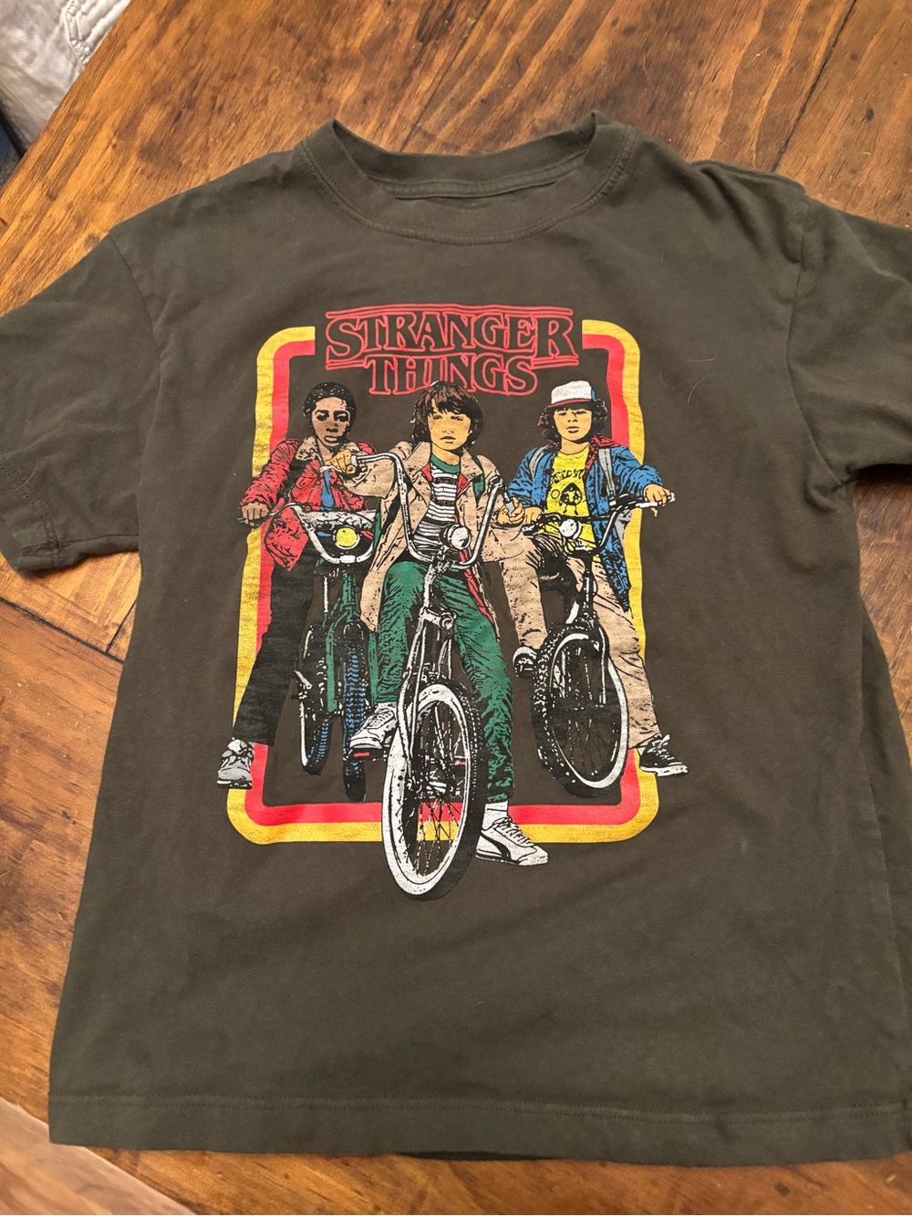 Stranger Things Graphic Tee - Olive with Retro Bike Print kids S/6